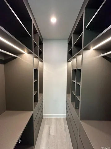 a view of walk in hallway with windows