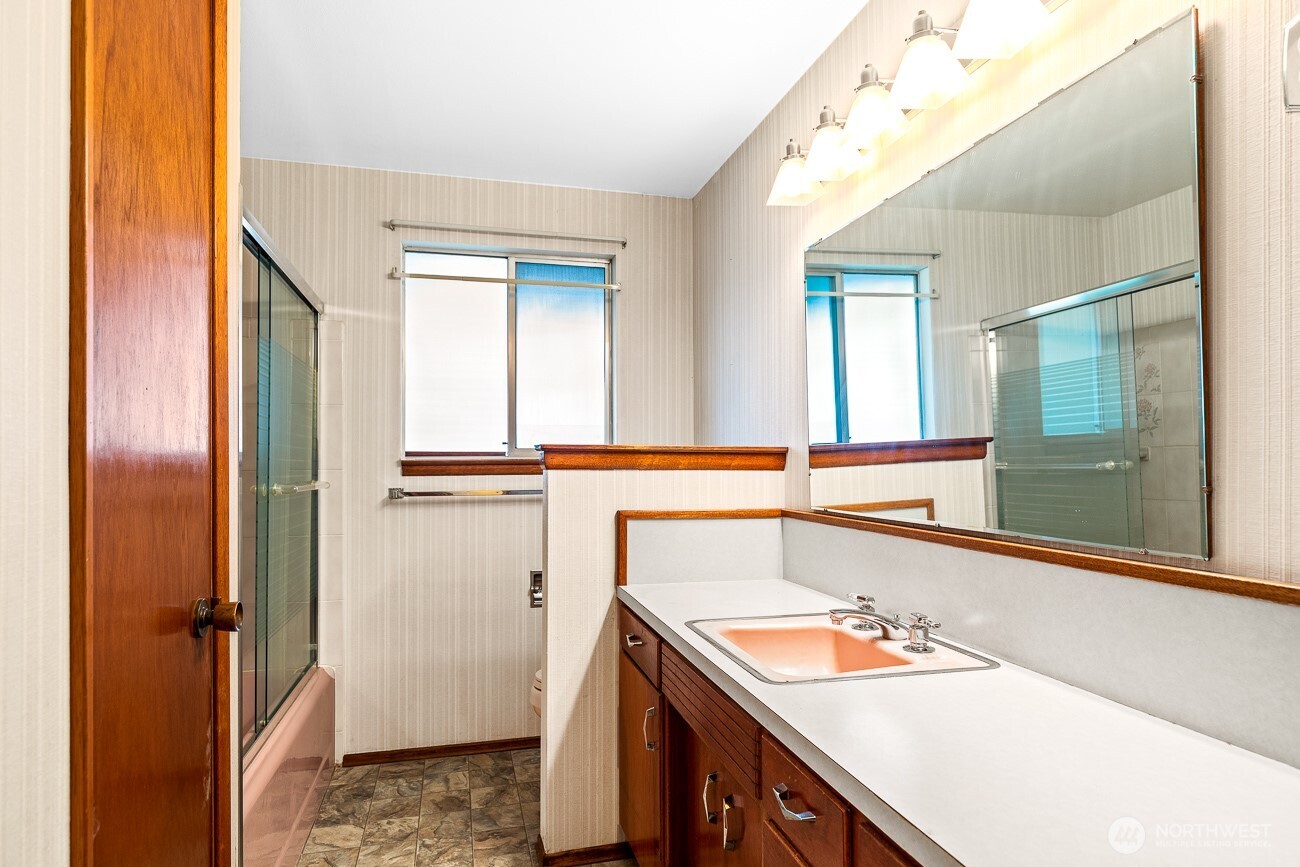 1006 North 36th Street Renton, WA 98056 - Photo 12 of 21 a bathroom with a sink and a mirror