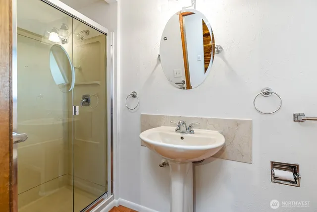 a bathroom with a sink and a mirror
