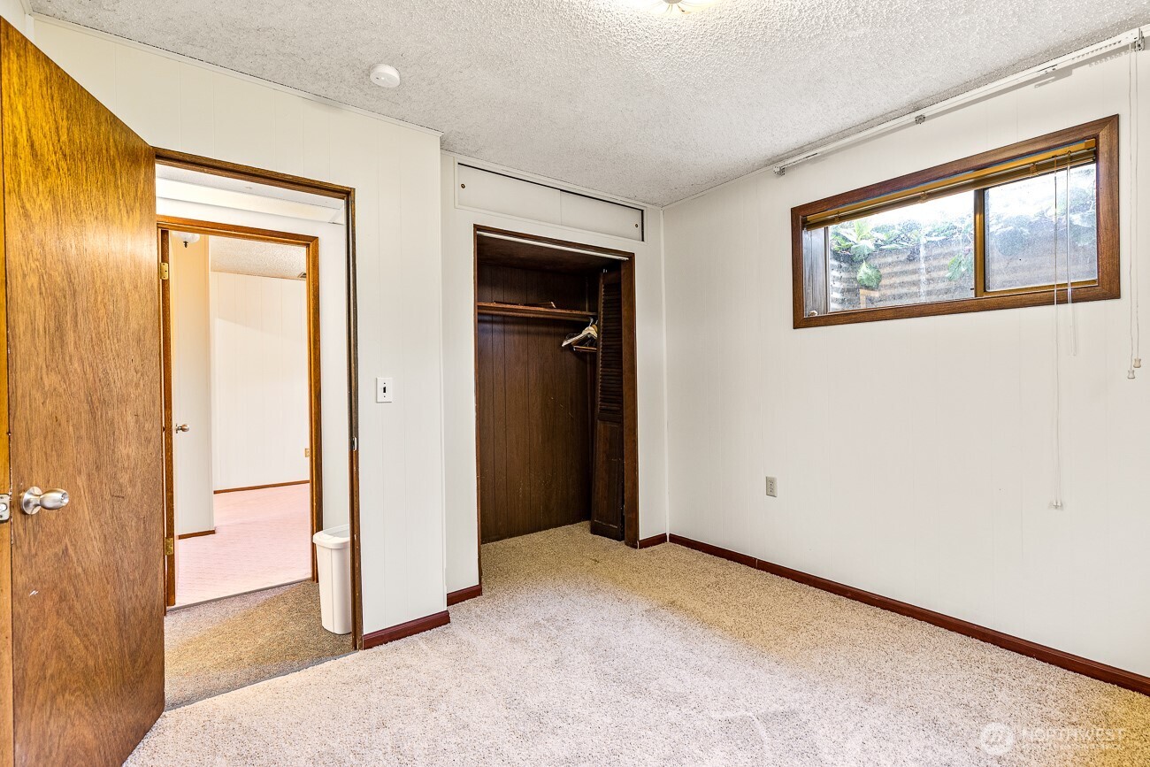 1006 North 36th Street Renton, WA 98056 - Photo 18 of 21 a view of an empty room and a window