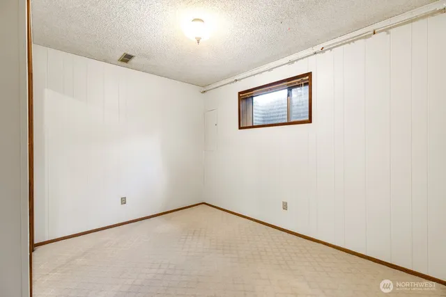 an empty room with a empty space and a window