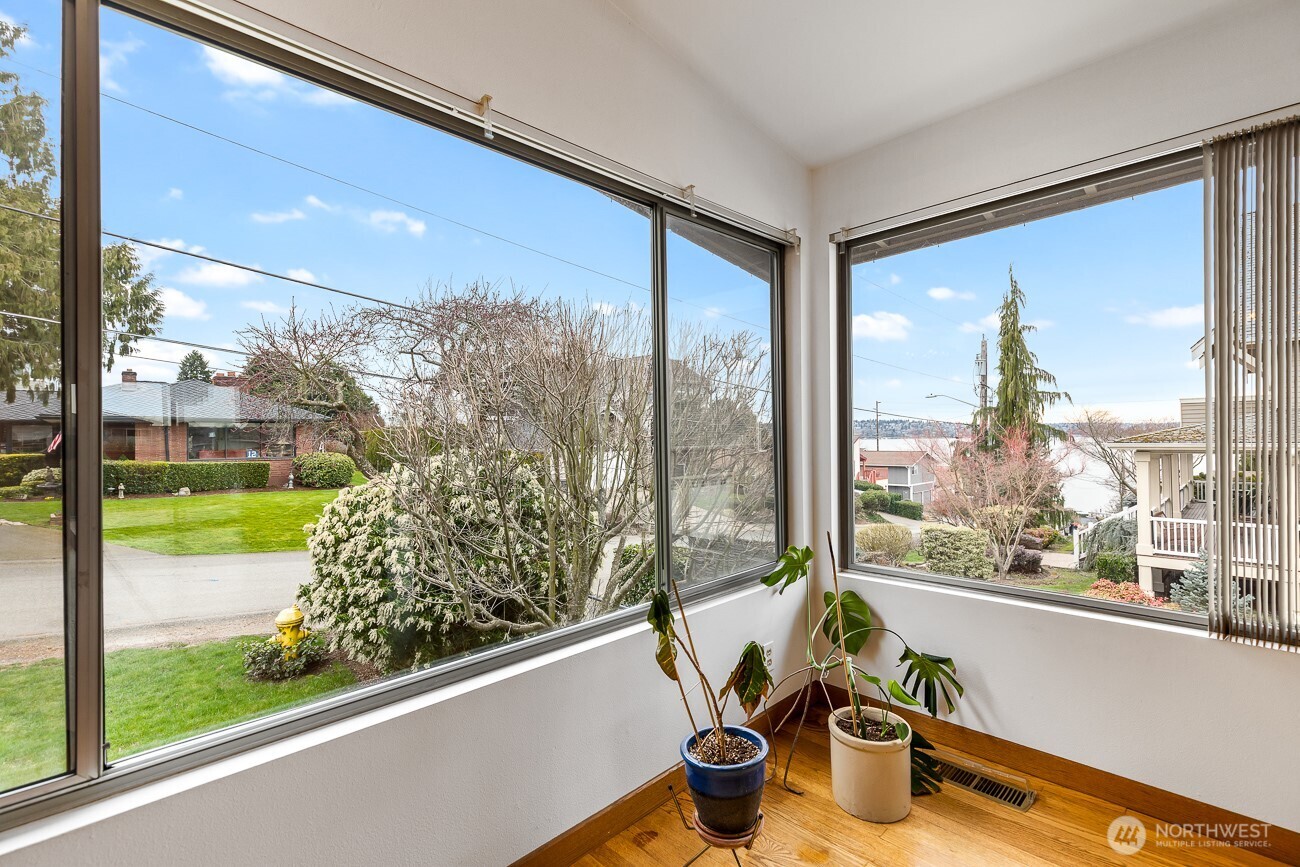 1006 North 36th Street Renton, WA 98056 - Photo 2 of 21 a view of a room with a large window and bed