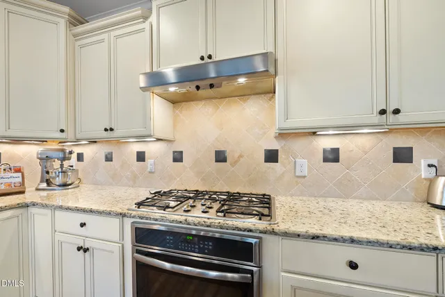 a bathroom with a sink vanity mirror and toilet