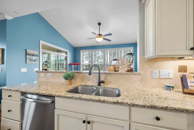 a living room with furniture and a bookshelf