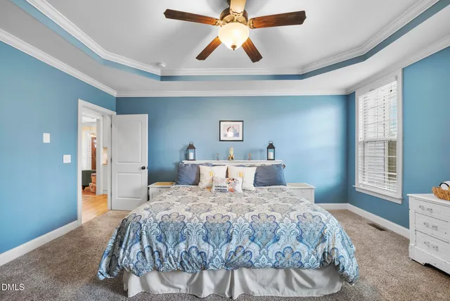 a bedroom with a bed and a desk