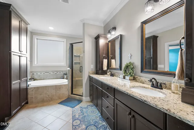 a living room with furniture and floor to ceiling windows