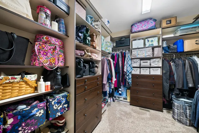 a view of a patio with a table chairs and a fire pit