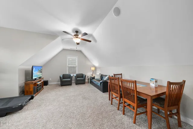 a view of a house with swimming pool and sitting area
