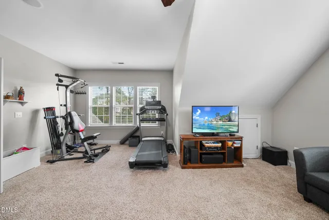 a room with furniture and a book shelf