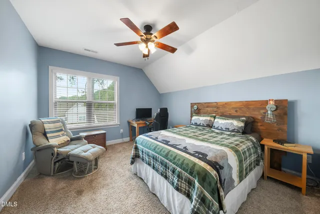 a view of a lake with houses in the back