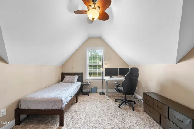 a view of a yard with large trees