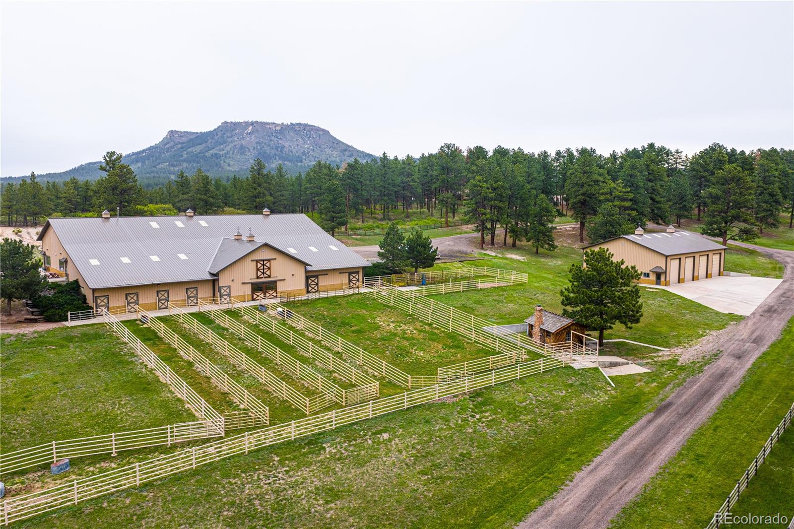 3282 Tomah Road Larkspur, CO 80118 - Photo 7 of 35 a view of a house with a yard