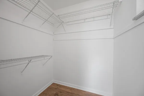 a bathroom with a double vanity sink a mirror and a bathtub