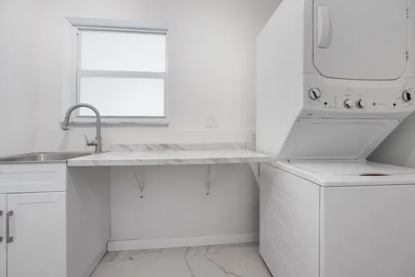 a balcony with table and chairs