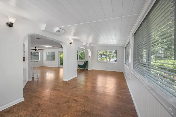 a view of an entryway with wooden floor
