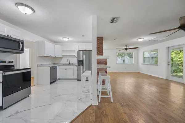 a large kitchen with cabinets
