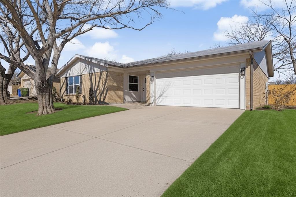 6517 Ridglea Drive Watauga, TX 76148 - Photo 1 of 1 a front view of house with yard and green space
