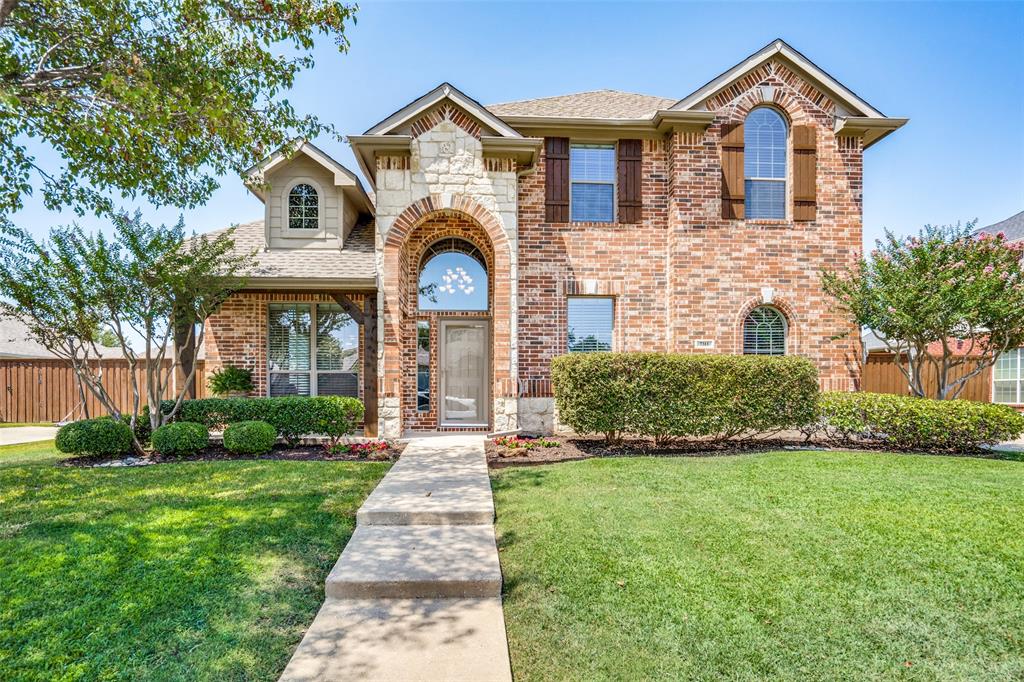 7311 Sparrow Point Lane Sachse, TX 75048 - Photo 1 of 1 a front view of a house with a yard