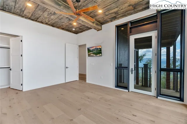 a view of a room with large windows