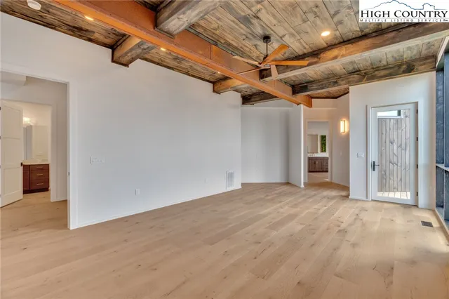 a bathroom with a granite countertop sink toilet a mirror and shower