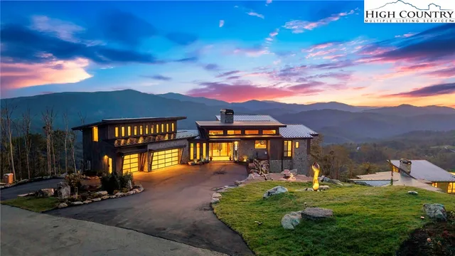 a view of a big house with a big yard