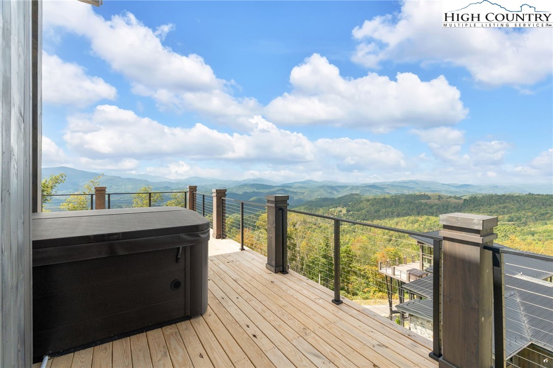 294 Silver Eagle Trail Banner Elk, NC 28604 - Photo 42 of 50 a view of a balcony with wooden floor & fence