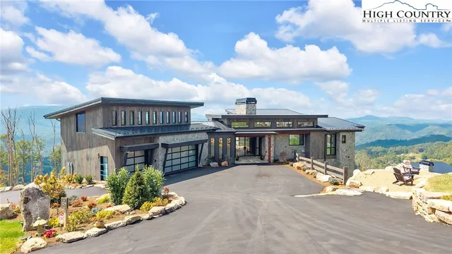 a swimming pool with outdoor seating and yard