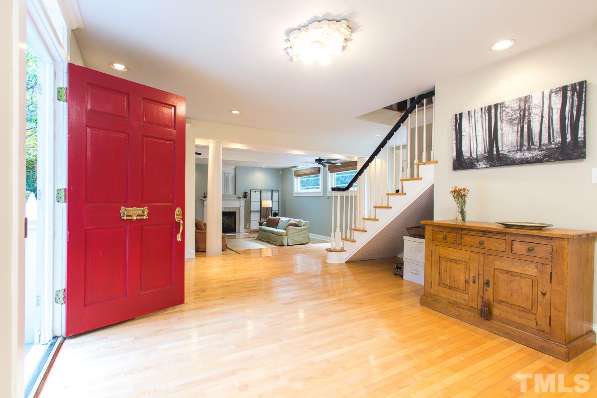1715 Six Gables Road Durham, NC 27712 - Photo 10 of 25 Did you think we forgot all about the front door? Nah, we got one of those...and boy is it ever grand! Red, of course. Check out the brass antique-style mail slot. Swanky, right? No stairwell in the way as you welcome guests into this generous space.