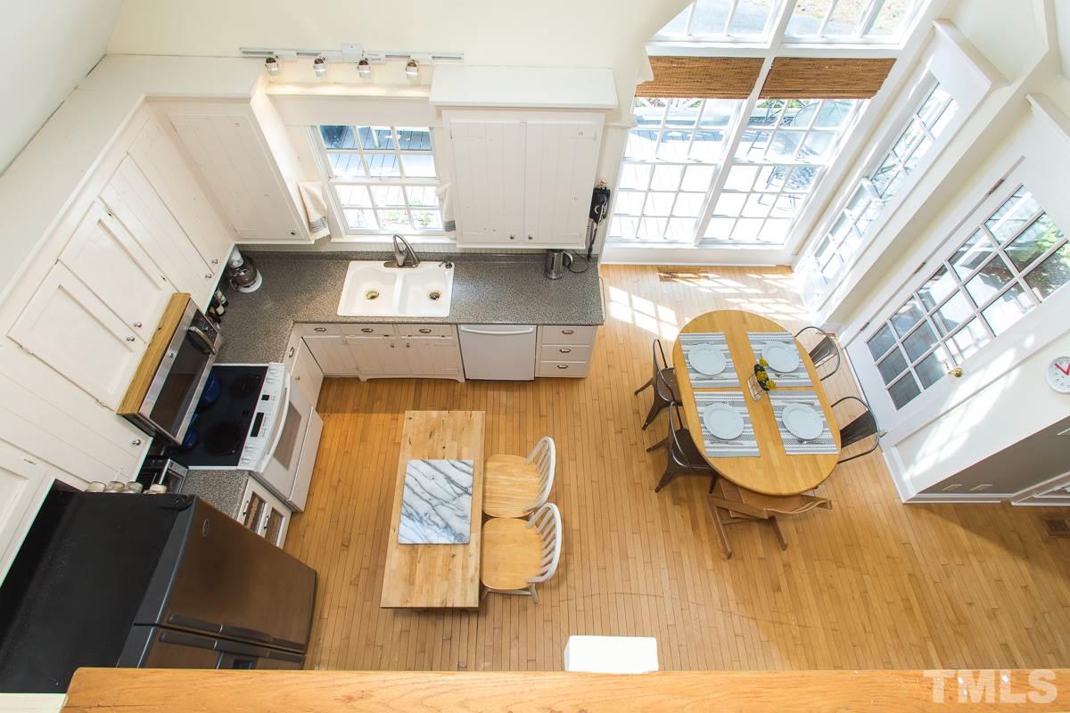 1715 Six Gables Road Durham, NC 27712 - Photo 21 of 25 From the upstairs hallway, you can easily see how dinner's coming along or check to see if the coast is clear for a midnight kitchen raid via the spiral staircase!