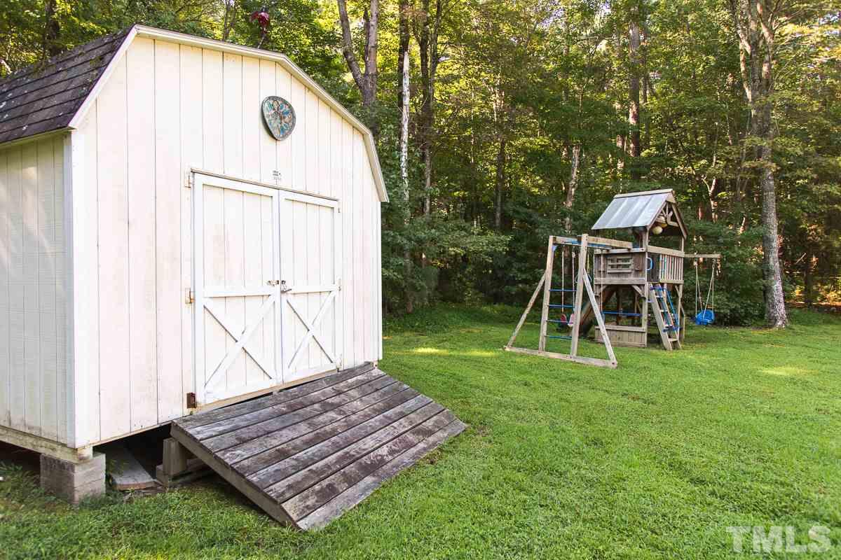1715 Six Gables Road Durham, NC 27712 - Photo 24 of 25 The 2 sheds will hold lots of yard equipment (notice the ramp for a riding mower) and your bicycles (did I mention you're only 7 miles from the awesome mountain biking trails at Little River Regional Park?) The play structure is included with the house.