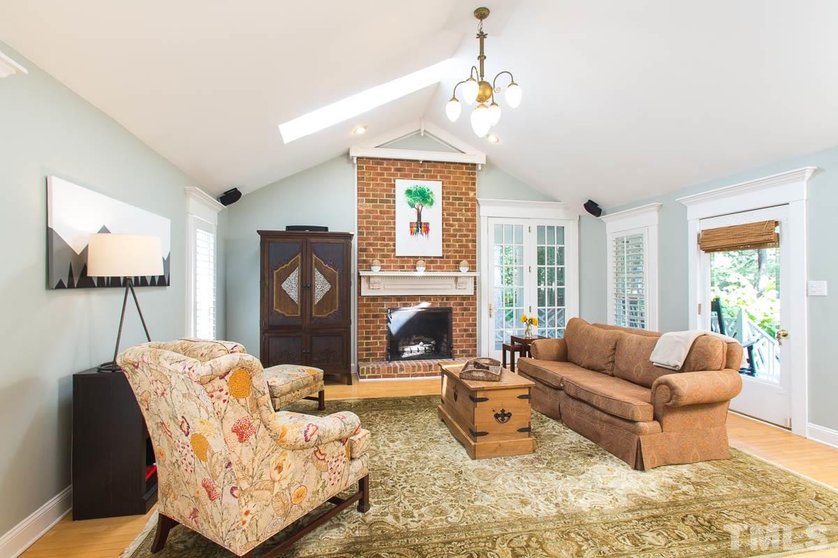 1715 Six Gables Road Durham, NC 27712 - Photo 3 of 25 This great room is the perfect spot for watching movies, enjoying a fire, kids' play area and more. The armoire is included with the house and has been passed from owner to owner. It makes a great stereo/TV/game console cabinet.