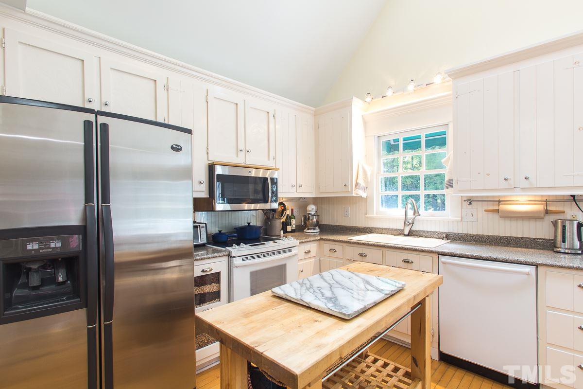 1715 Six Gables Road Durham, NC 27712 - Photo 5 of 25 The kitchen is laid out in an efficient work triangle that makes cooking much easier. Who wants to cross a vast kitchen space with a pot of boiling water. No worries here- everything you need in a well-designed layout.