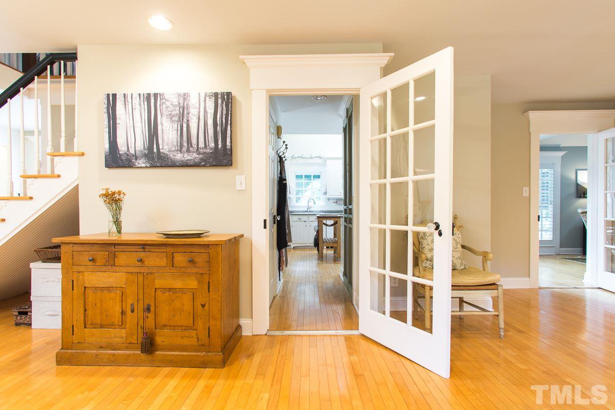 1715 Six Gables Road Durham, NC 27712 - Photo 8 of 25 This hallway is a short straight shot from the dining room to the kitchen but even the hallway has a lot more to offer. Here you'll find a fantastic pantry with screen doors that give it a great farmhouse feel as well as a half bath for convenience.