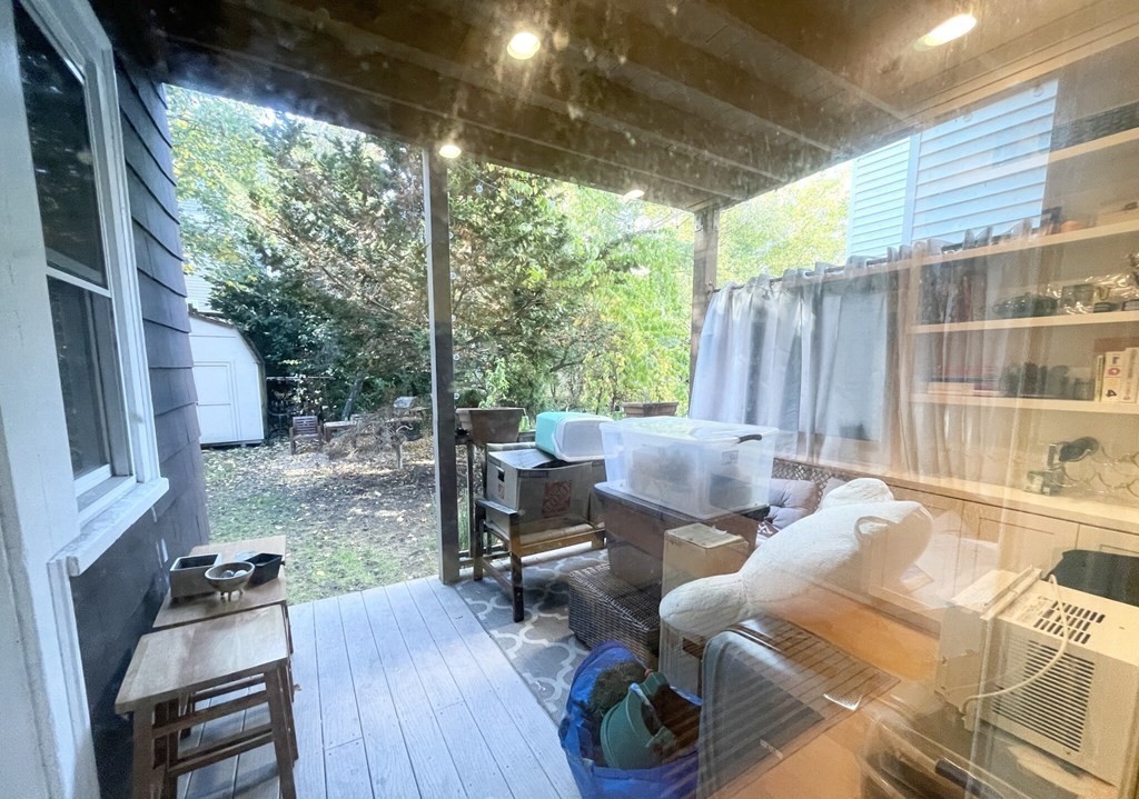 108 Buttonwood Street, Unit 1 Boston, MA 02125 - Photo 12 of 12 a backyard of a house with outdoor seating