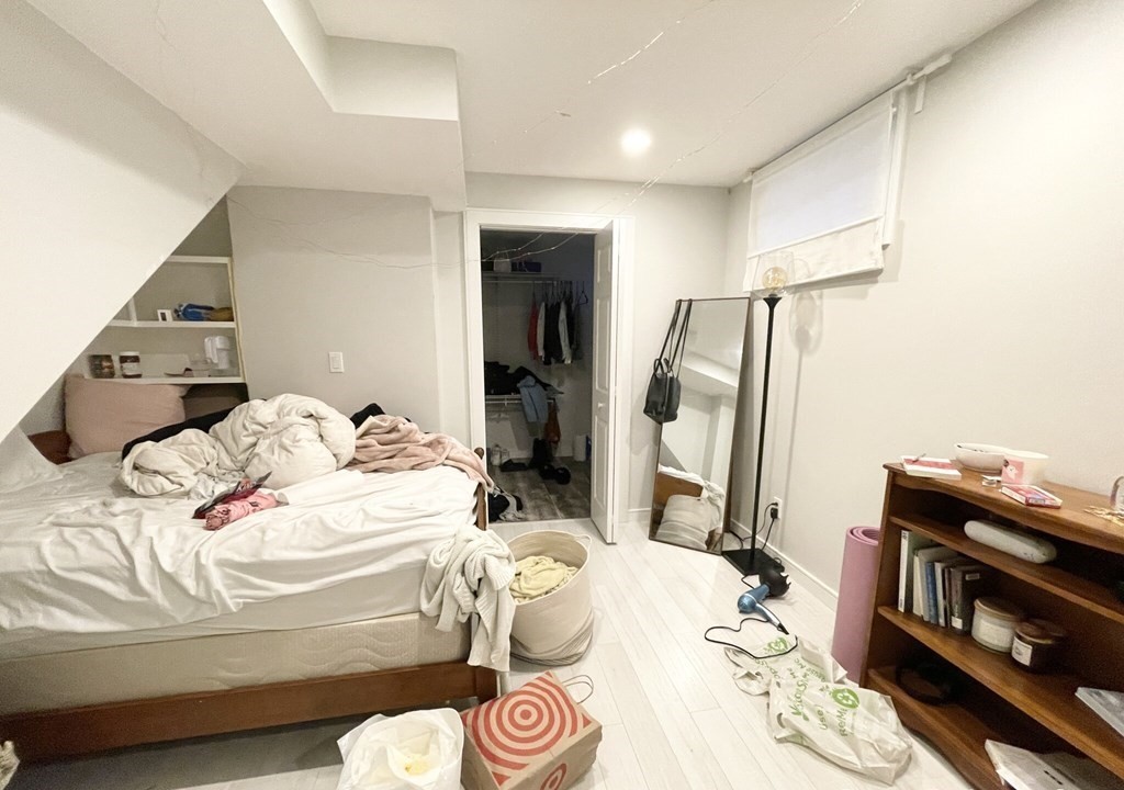 108 Buttonwood Street, Unit 1 Boston, MA 02125 - Photo 9 of 12 a bedroom with a bed and a dresser