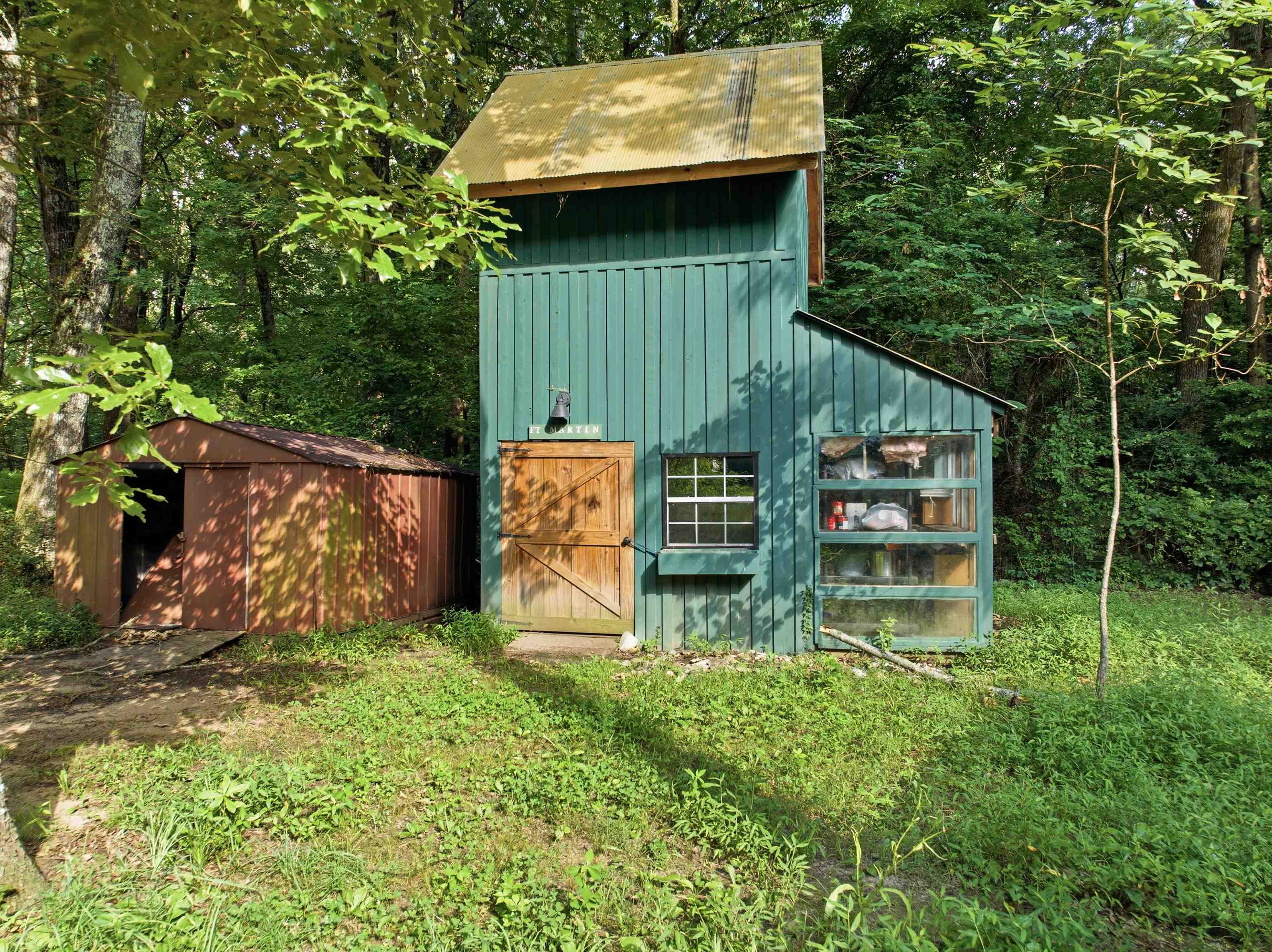 7320 McKinstry Road Moscow, TN 38057 - Photo 27 of 40 Versatile detached workshop offers endless possibilities as a hobby space, woodworking shop, art studio, home office, storage, or future guest retreat—all tucked into a peaceful wooded setting.
