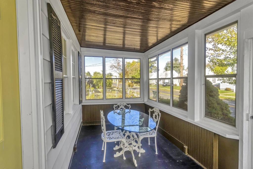 274 Abbott Street Springfield, MA 01118 - Photo 13 of 42 a view of a dining room with furniture window and wooden floor