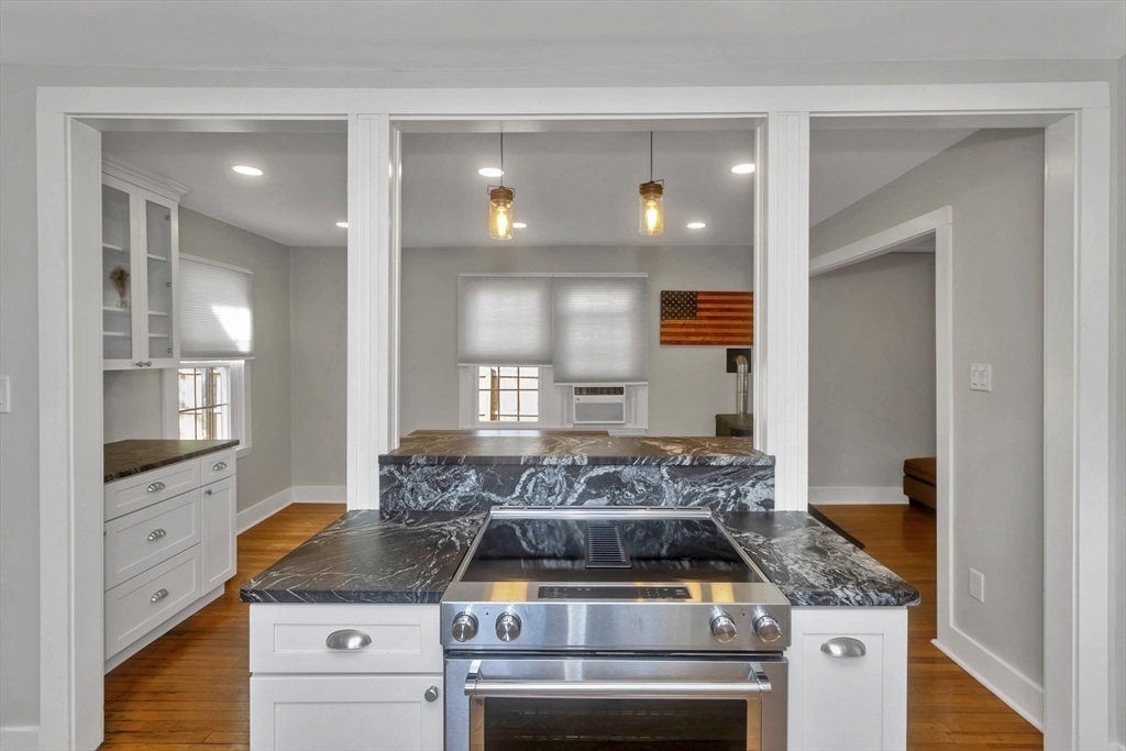 274 Abbott Street Springfield, MA 01118 - Photo 14 of 42 a kitchen with a stove and cabinets