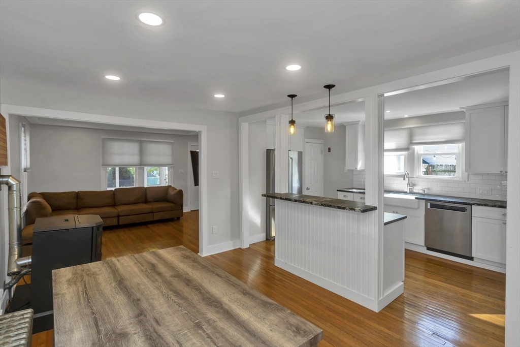 274 Abbott Street Springfield, MA 01118 - Photo 17 of 42 a kitchen with kitchen island white cabinets and stainless steel appliances