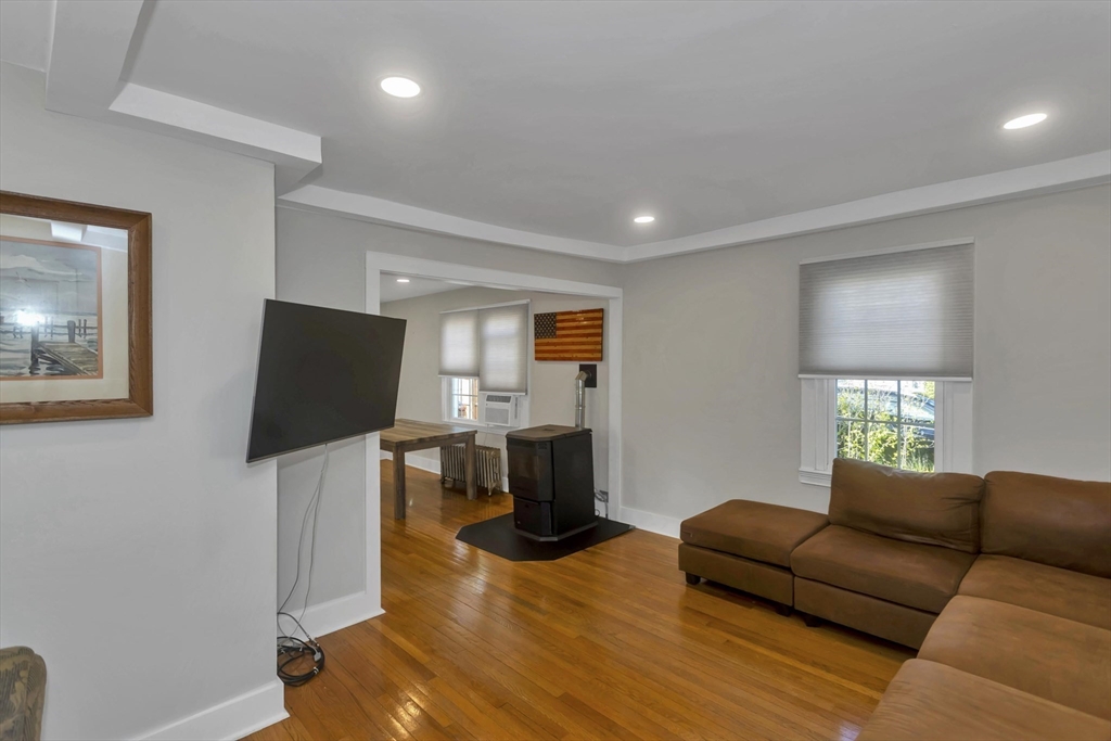 274 Abbott Street Springfield, MA 01118 - Photo 20 of 42 a living room with furniture and a flat screen tv