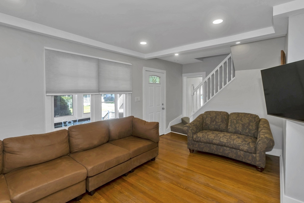 274 Abbott Street Springfield, MA 01118 - Photo 22 of 42 a living room with furniture and a flat screen tv