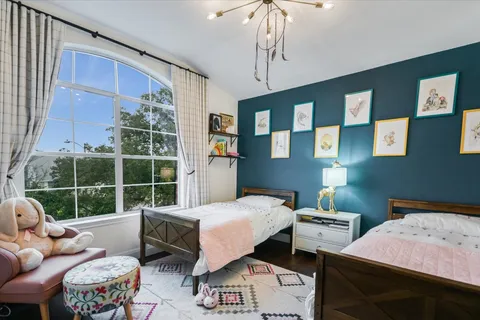 a bedroom with furniture and a window