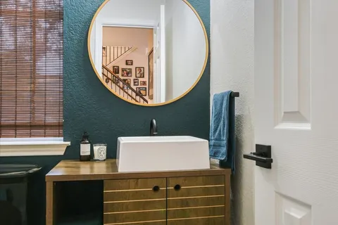 a bathroom with a sink and a mirror