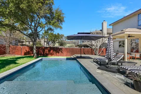 a view of a backyard with hardwood