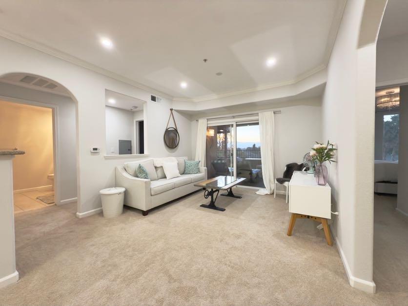 801 South Winchester Boulevard, Unit 4310 San Jose, CA 95128 - Photo 1 of 38 a living room with furniture and a couch