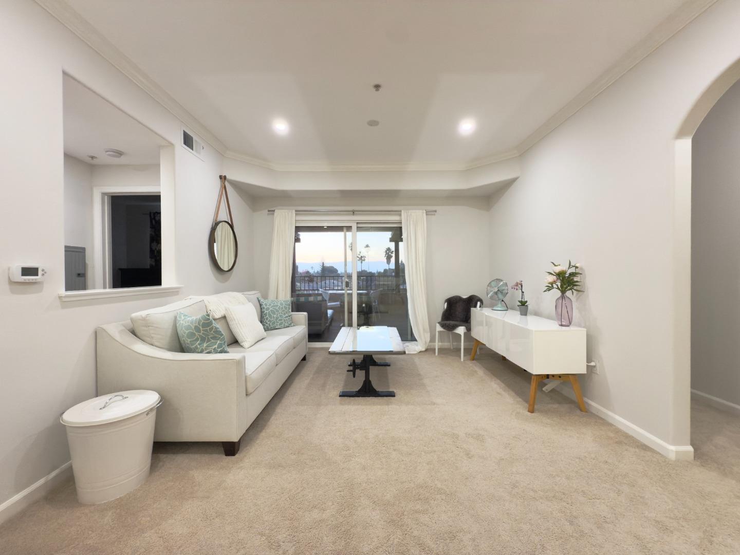 801 South Winchester Boulevard, Unit 4310 San Jose, CA 95128 - Photo 15 of 38 a living room with furniture and a large window