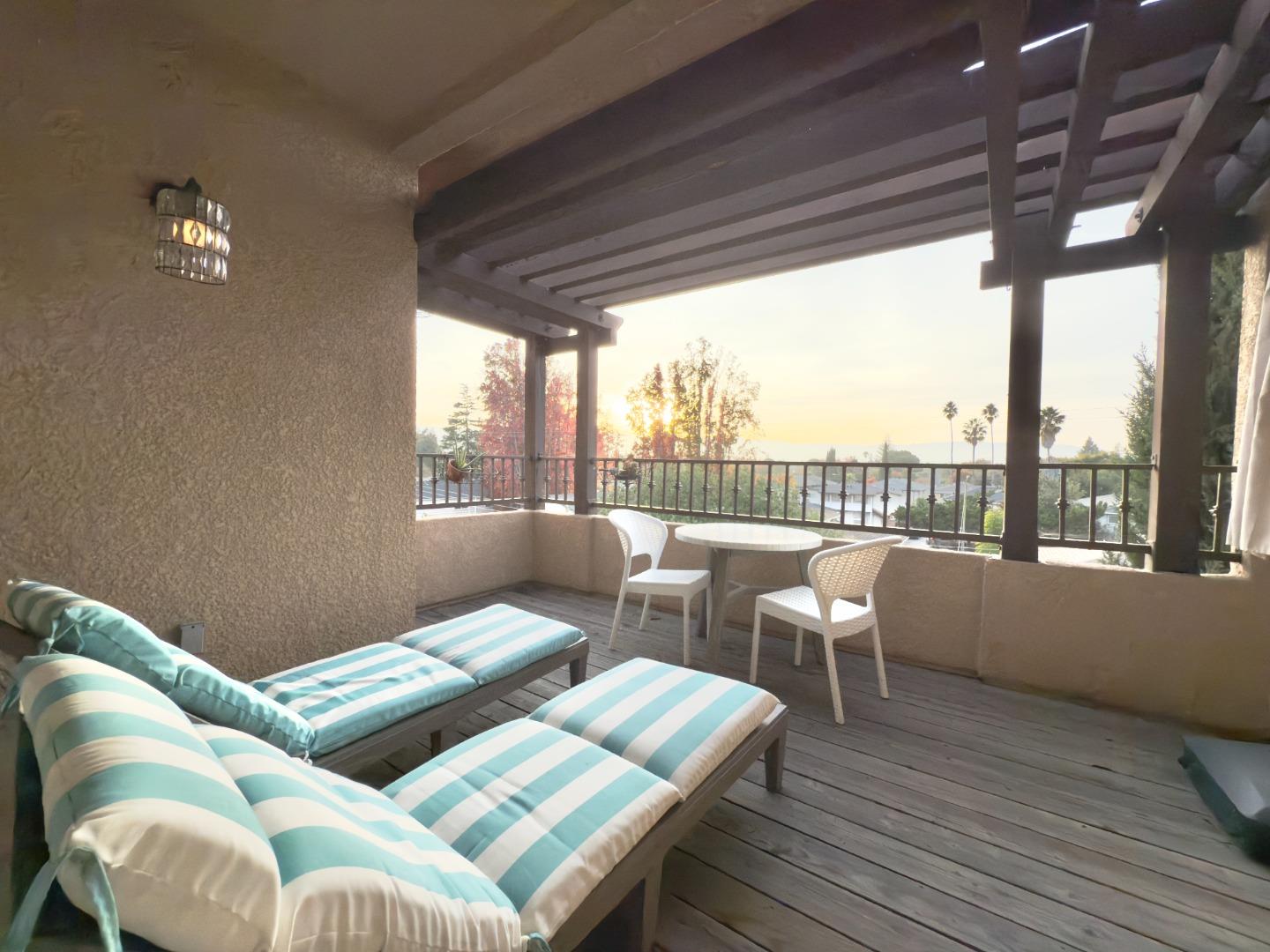 801 South Winchester Boulevard, Unit 4310 San Jose, CA 95128 - Photo 16 of 38 a bedroom with furniture and a large window