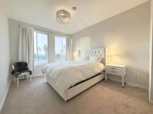 a room with a bed and a window