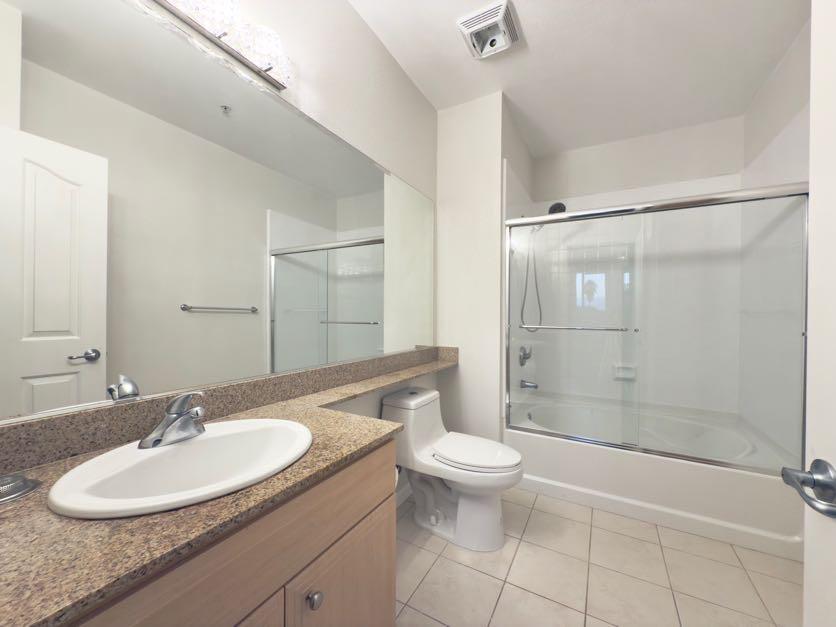 801 South Winchester Boulevard, Unit 4310 San Jose, CA 95128 - Photo 20 of 38 a bathroom with a sink toilet and shower