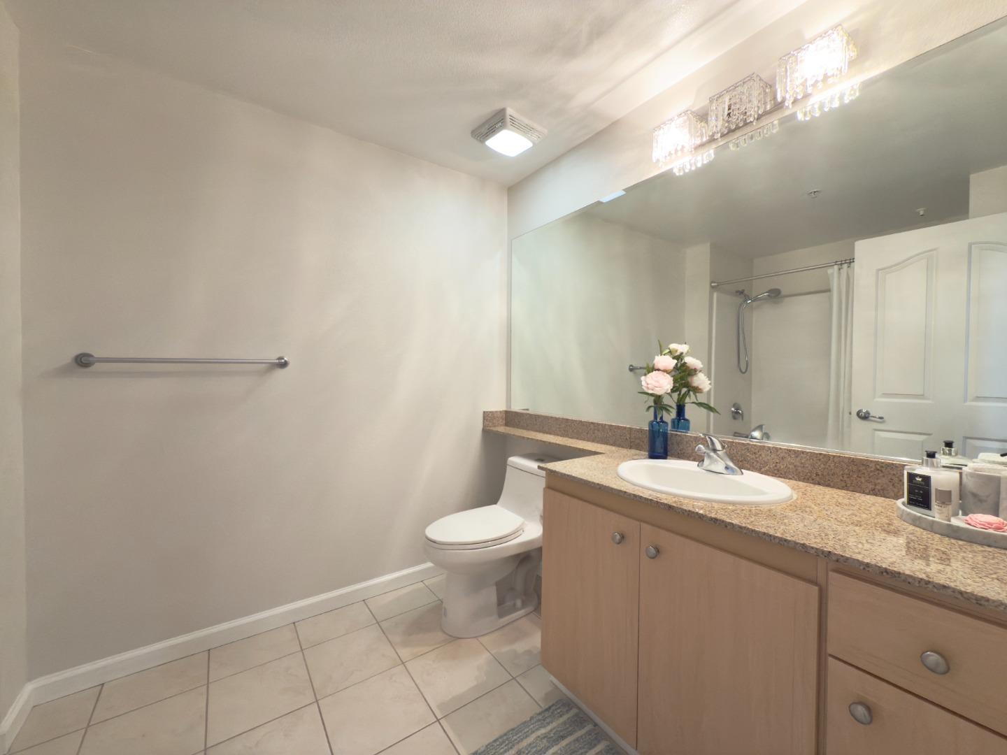 801 South Winchester Boulevard, Unit 4310 San Jose, CA 95128 - Photo 24 of 38 a bathroom with a sink and a toilet
